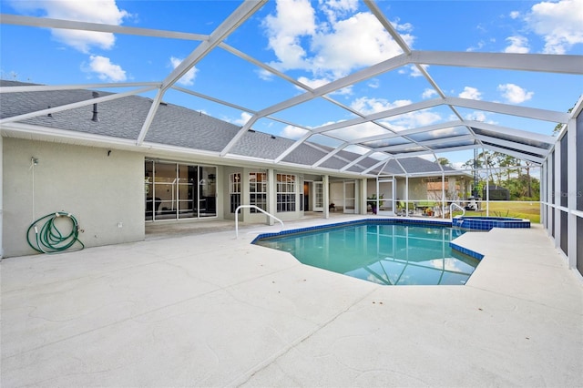 view of pool with a patio, a pool with connected hot tub, and a lanai