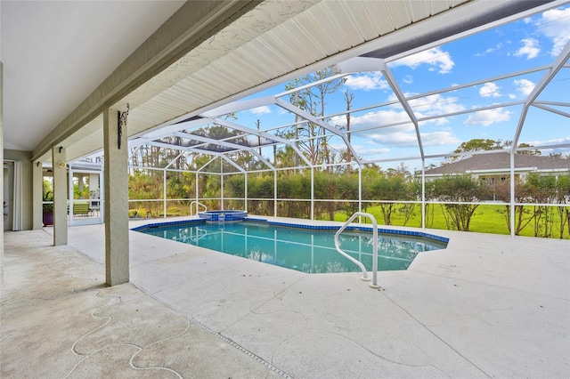 view of swimming pool featuring a lanai, a patio area, and a pool with connected hot tub