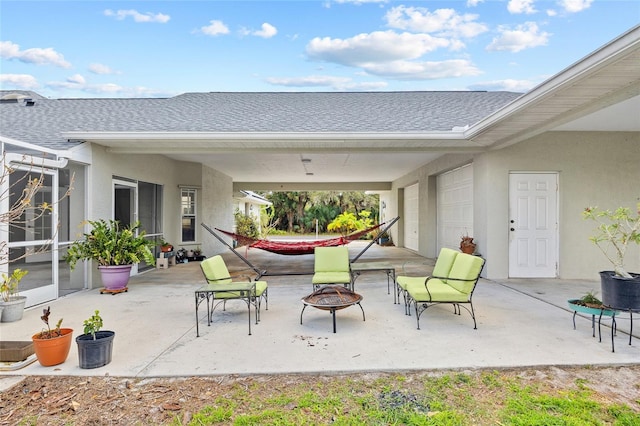 view of patio / terrace with a fire pit