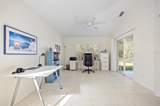 office area featuring light tile patterned floors, visible vents, a healthy amount of sunlight, and a ceiling fan