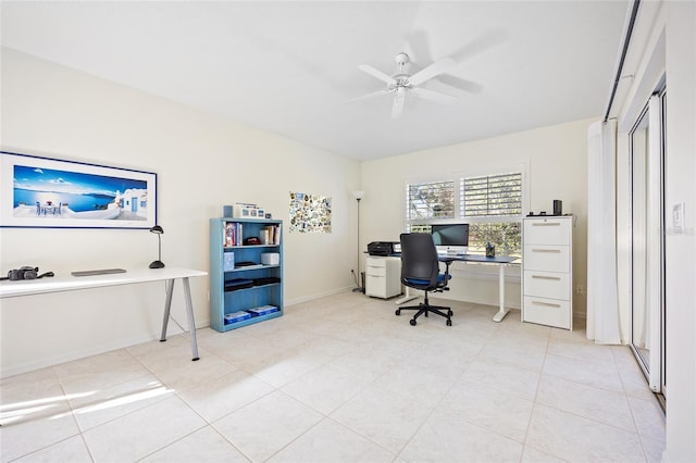 tiled office with baseboards and ceiling fan