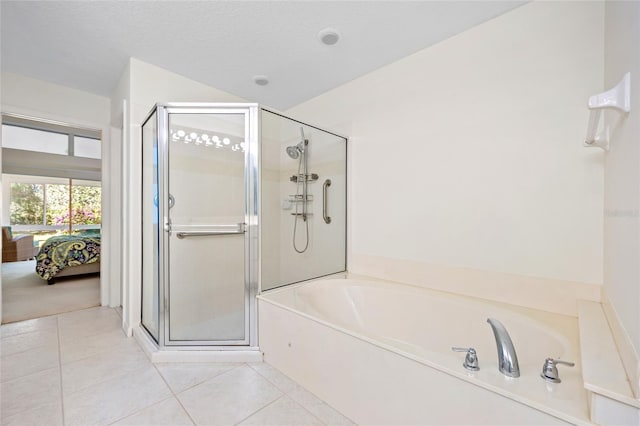 bathroom featuring tile patterned floors, a textured ceiling, connected bathroom, a shower stall, and a bath