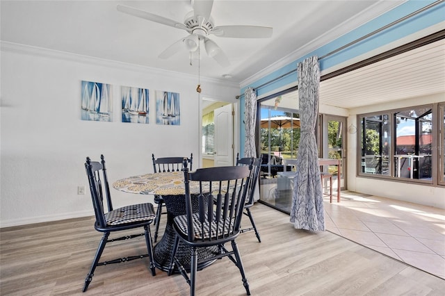 dining area with ceiling fan, baseboards, ornamental molding, light wood-style floors, and a sunroom