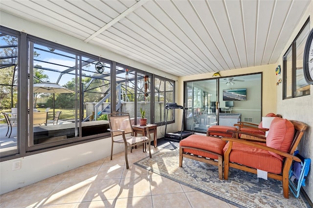 sunroom featuring visible vents and wood ceiling