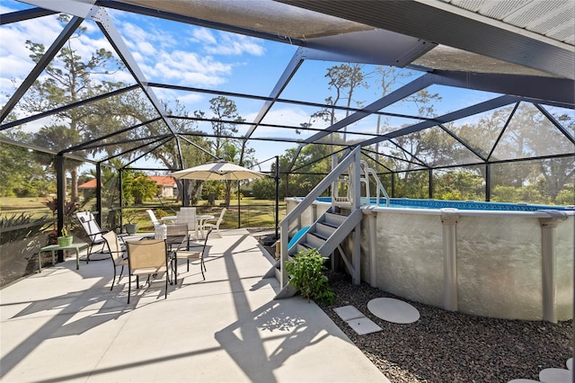 view of patio featuring a lanai and an outdoor pool