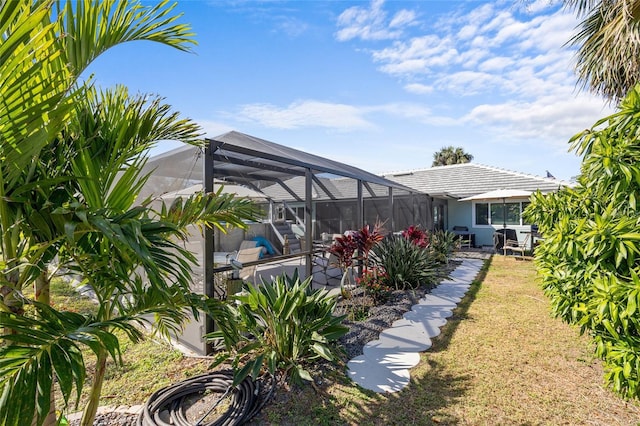 view of yard with a lanai and a patio