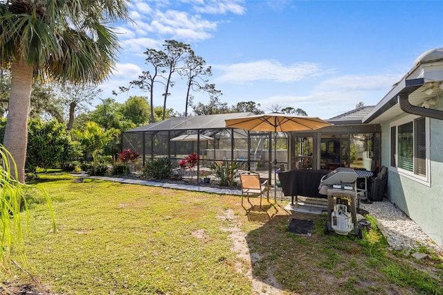 view of yard featuring glass enclosure