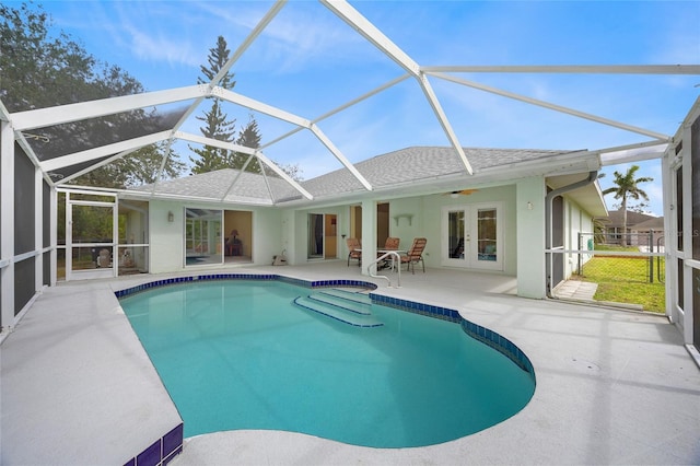 pool featuring a lanai, french doors, a patio, and ceiling fan