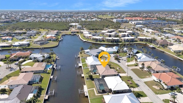 bird's eye view featuring a water view and a residential view