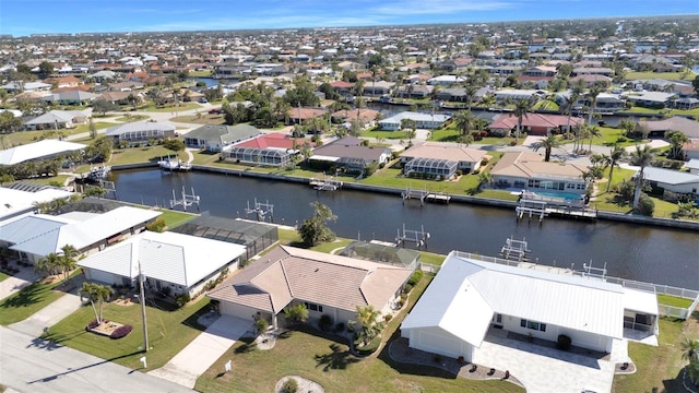 bird's eye view with a water view and a residential view