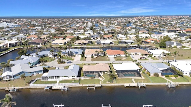 aerial view with a water view and a residential view