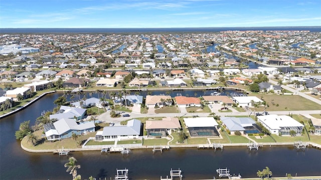 bird's eye view featuring a residential view and a water view
