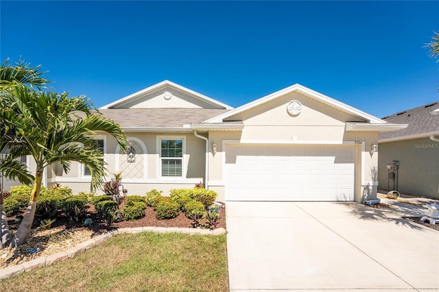 single story home with stucco siding, an attached garage, driveway, and a shingled roof