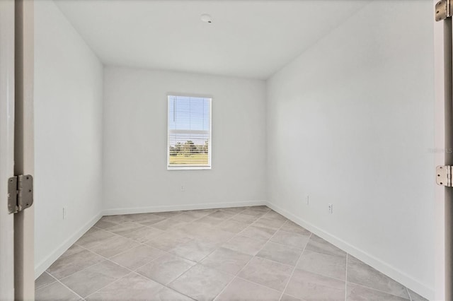 empty room with baseboards