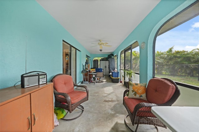 sunroom with a ceiling fan