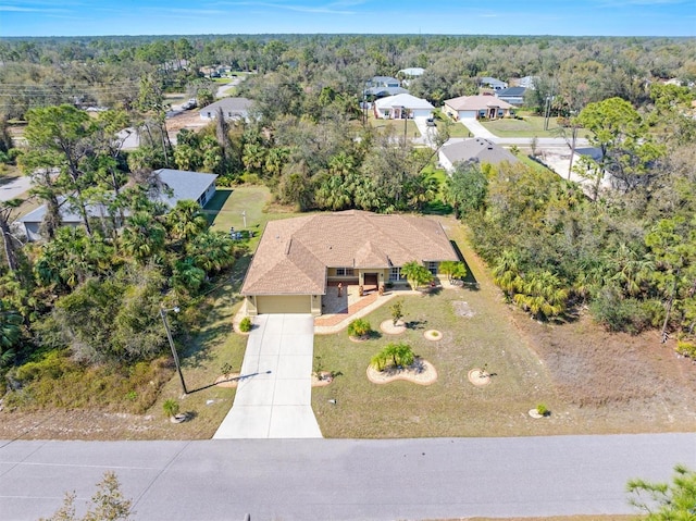 drone / aerial view featuring a view of trees