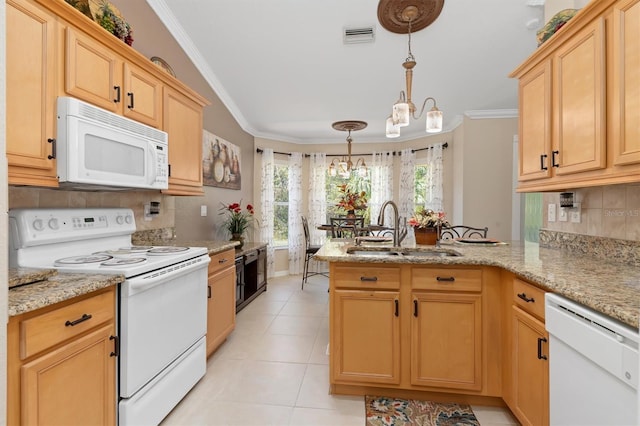 kitchen with a peninsula, white appliances, a sink, visible vents, and crown molding