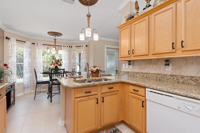 kitchen with a peninsula, a sink, dishwasher, tasteful backsplash, and crown molding