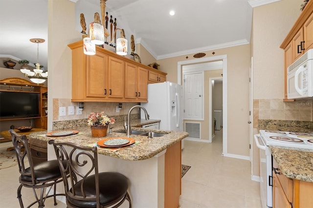 kitchen featuring crown molding, visible vents, a sink, white appliances, and a peninsula