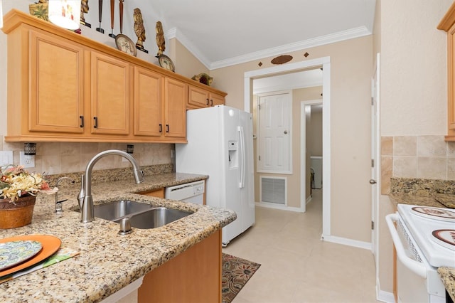 kitchen with white appliances, decorative backsplash, light stone counters, crown molding, and a sink