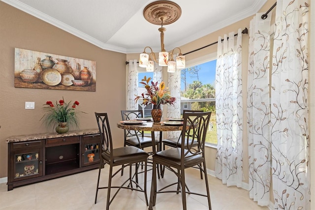 dining space with light tile patterned floors, baseboards, a chandelier, and ornamental molding