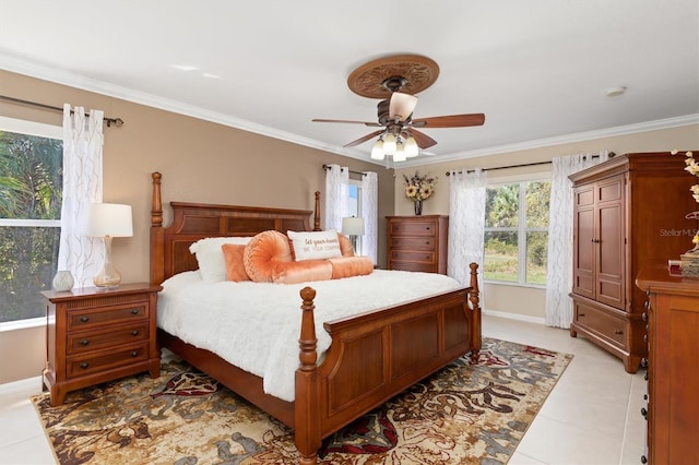 bedroom with ornamental molding, ceiling fan, baseboards, and light tile patterned floors