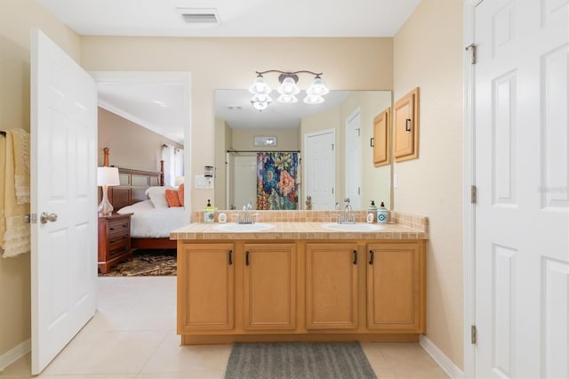 ensuite bathroom featuring double vanity, a sink, visible vents, and a shower with curtain