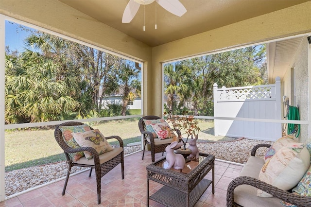 sunroom with a ceiling fan