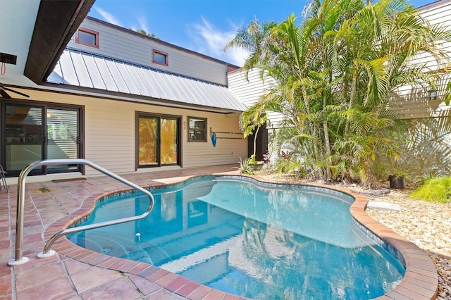 outdoor pool with a patio