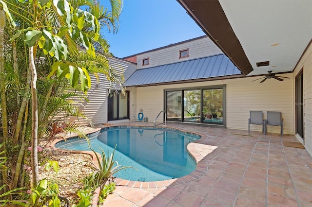 pool with a ceiling fan and a patio