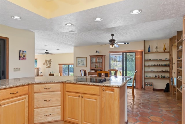 kitchen featuring a ceiling fan, recessed lighting, a textured ceiling, and black electric cooktop