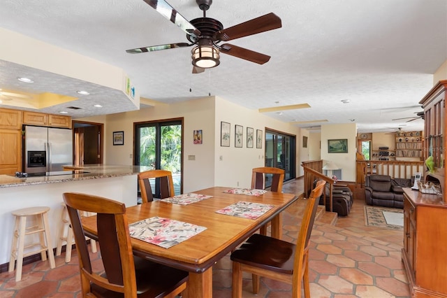 dining area with a textured ceiling, light tile patterned flooring, a ceiling fan, and recessed lighting