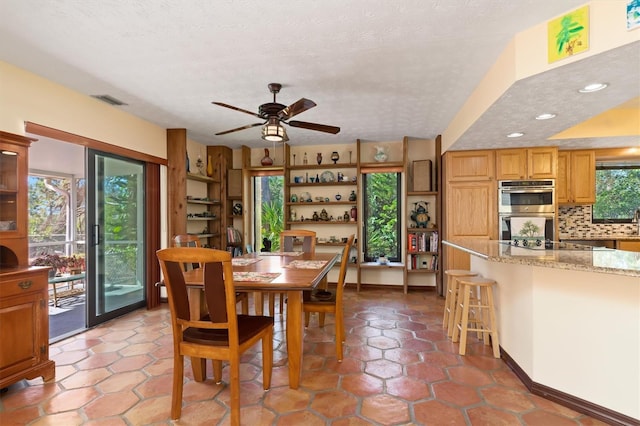 dining area with recessed lighting, visible vents, ceiling fan, and a textured ceiling