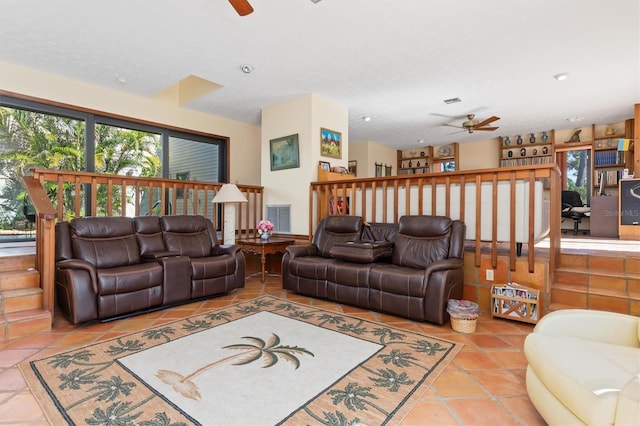 living area featuring a ceiling fan, tile patterned flooring, and visible vents