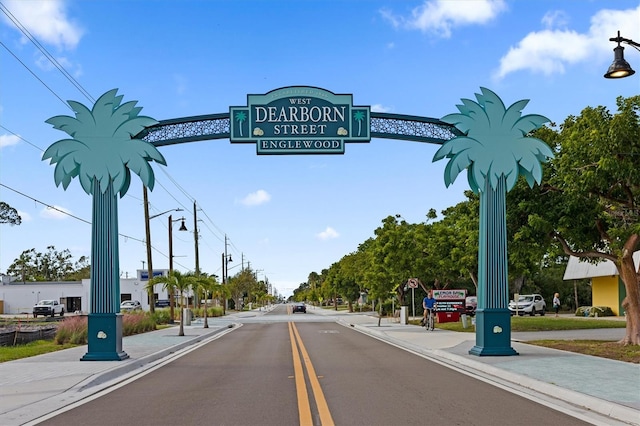 view of road with curbs, street lighting, and sidewalks