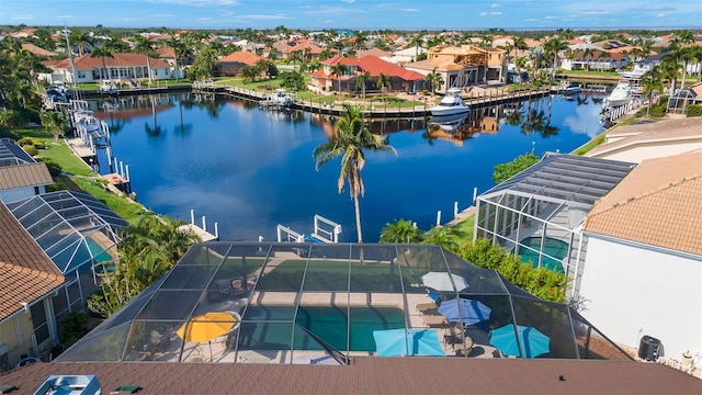 aerial view with a water view and a residential view