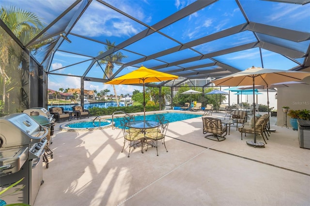 pool featuring a lanai and a patio area