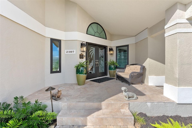 entrance to property with stucco siding and french doors