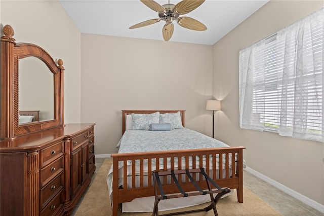 bedroom featuring baseboards and light tile patterned flooring