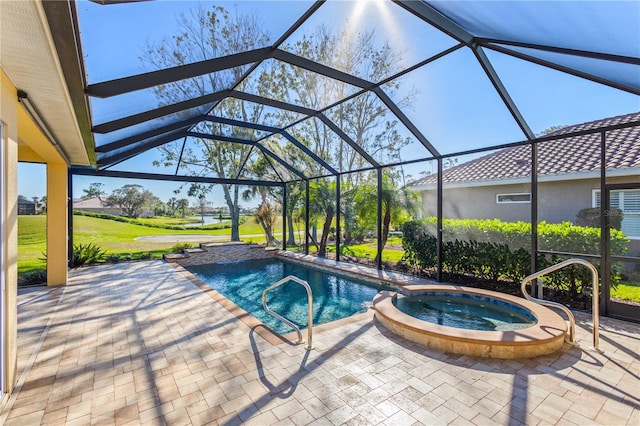 view of swimming pool with a lanai, a pool with connected hot tub, and a patio