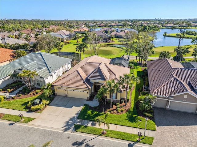 birds eye view of property featuring a water view and a residential view