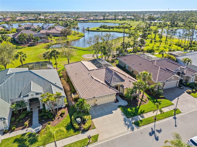 birds eye view of property featuring a water view and a residential view