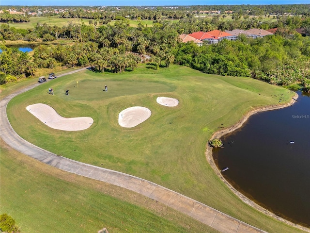 birds eye view of property featuring a water view and view of golf course