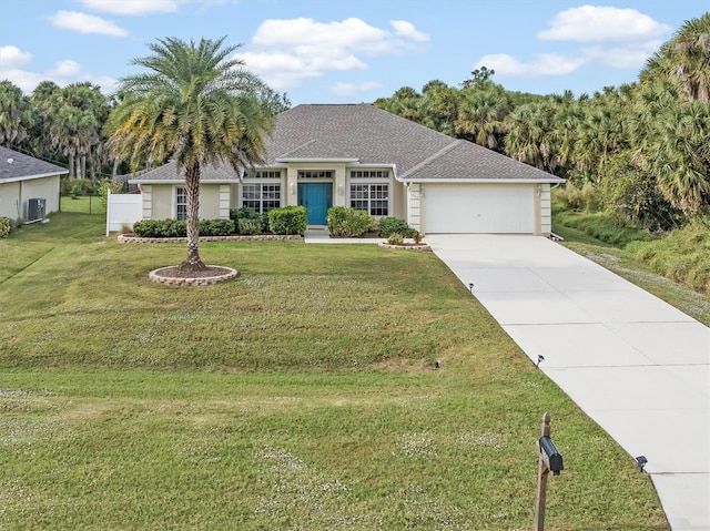 ranch-style home featuring a garage, driveway, and a front lawn