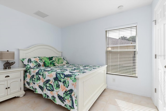 bedroom featuring visible vents and light tile patterned floors