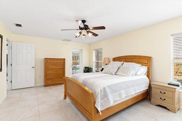 bedroom featuring light tile patterned floors, access to outside, visible vents, and a ceiling fan