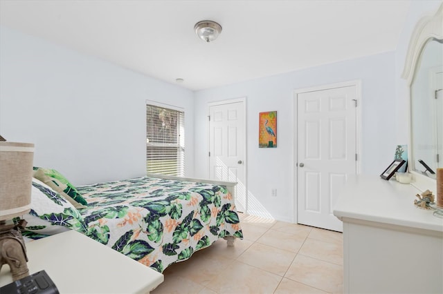 bedroom featuring light tile patterned floors