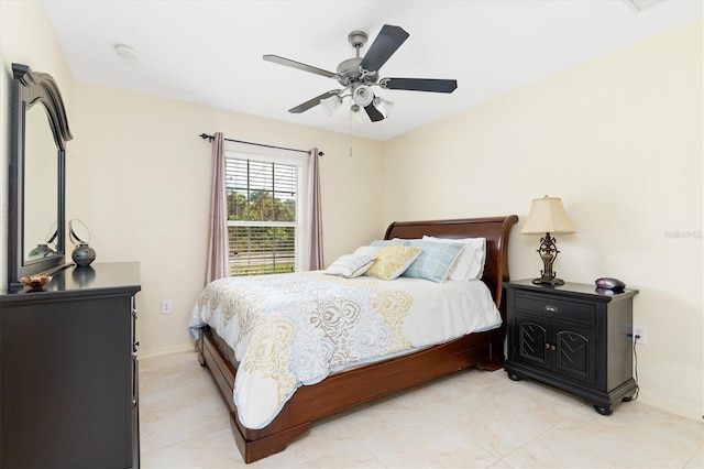 bedroom with baseboards and a ceiling fan