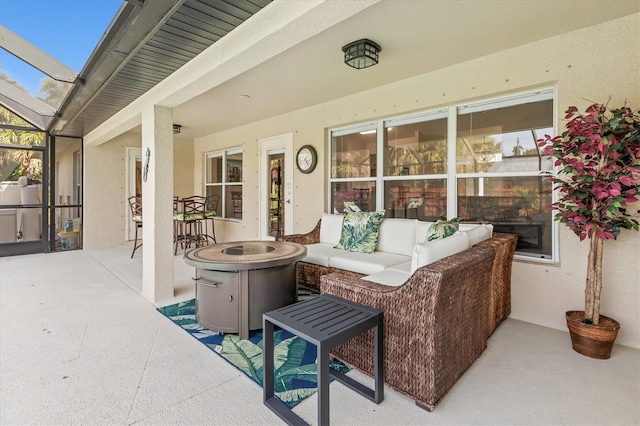 view of patio / terrace with glass enclosure and outdoor lounge area