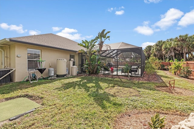 view of yard with glass enclosure, a patio, cooling unit, a fenced backyard, and a pool